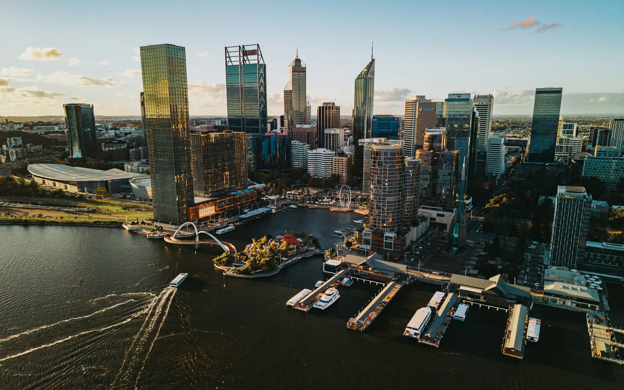 Perth skyscrapers beside the river at sunset